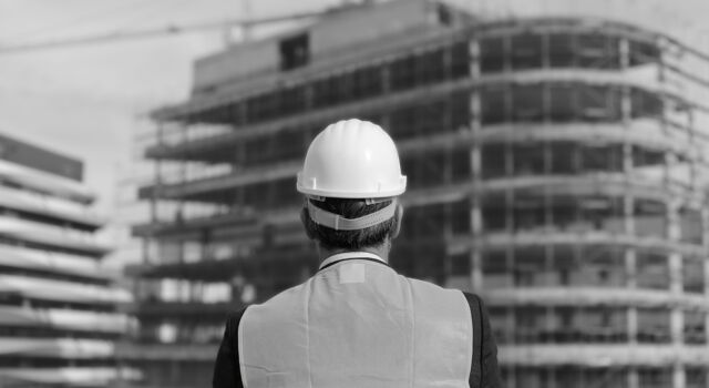 SINGLE-IMAGE_construction-worker-facing-building-site_may25