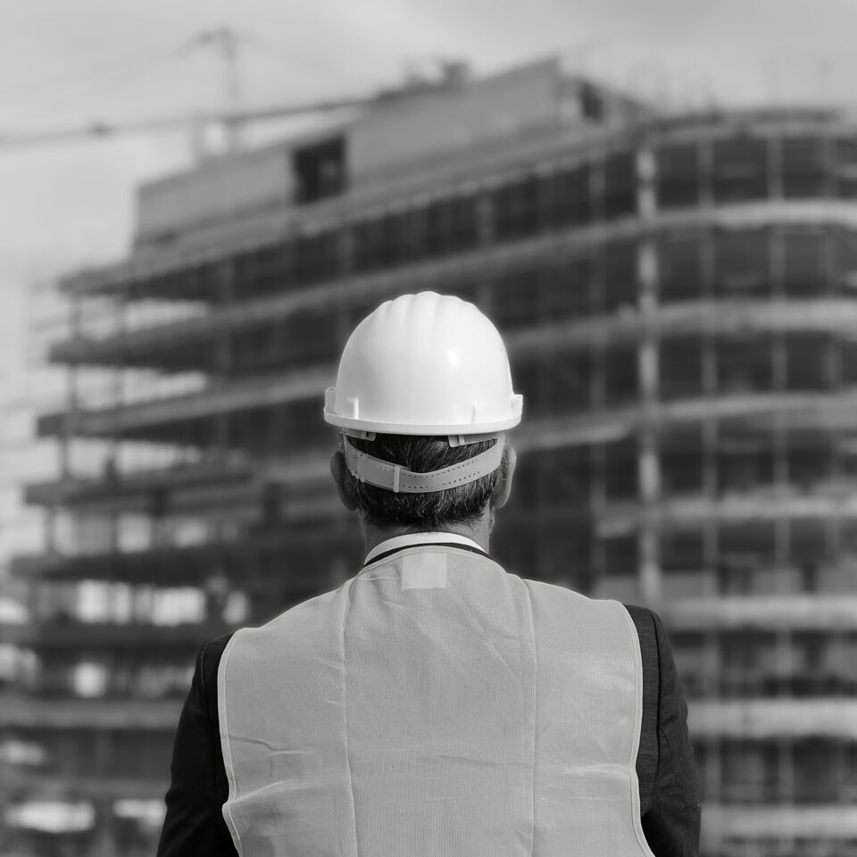 SINGLE-IMAGE_construction-worker-facing-building-site_may25