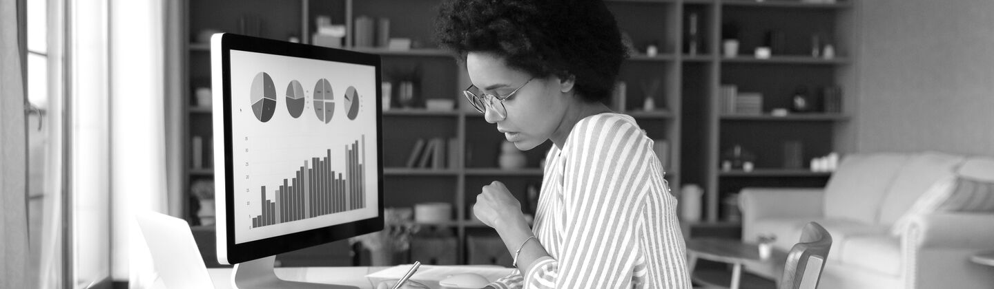 SINGLE-IMAGE_concentrated-young-african-american-woman-working-desktop_may24
