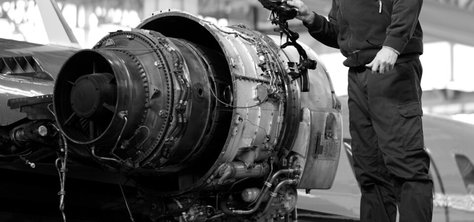 SINGLE-IMAGE_aerospace-engineer-checking-engine_feb24