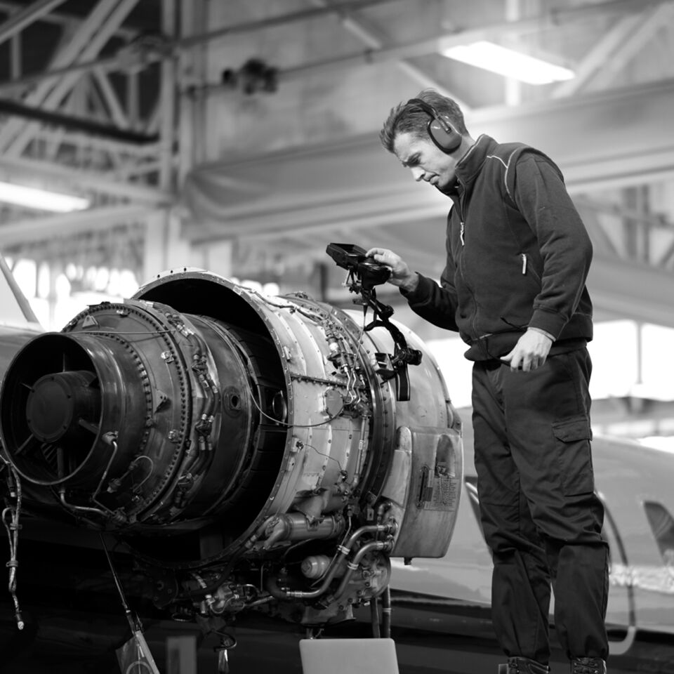 SINGLE-IMAGE_aerospace-engineer-checking-engine_feb24