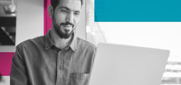 /bynder-asset/bynder:2F3F6BEE-0FDA-46FB-A395EDE6983526E2/Landscape_MD/SINGLE-IMAGE_squares-smiling-young-businessman-working-on-a-laptop_may25.png?1749636489000