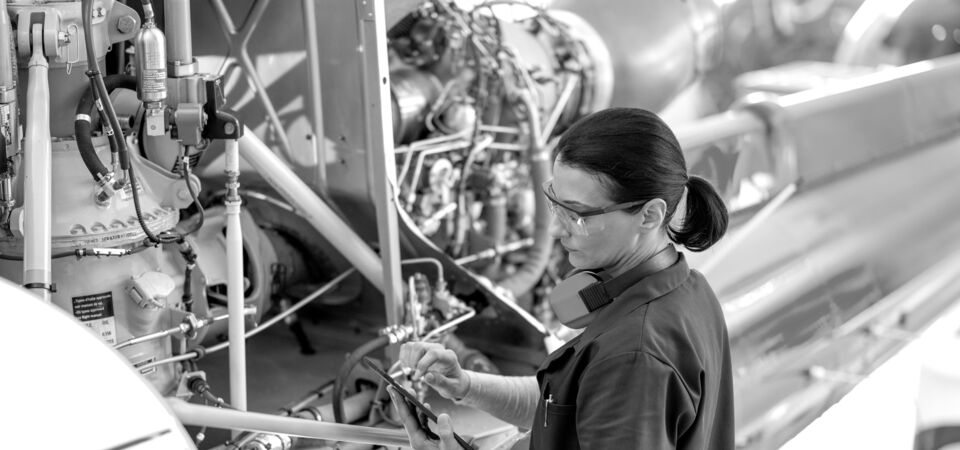 SINGLE-IMAGE_engineer-tablet-checking-airplane-engine_oct23