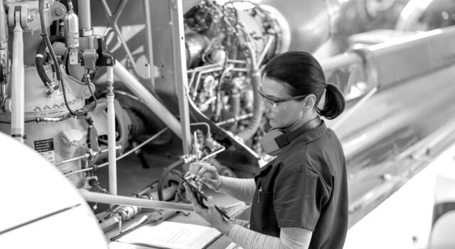 SINGLE-IMAGE_engineer-tablet-checking-airplane-engine_oct23