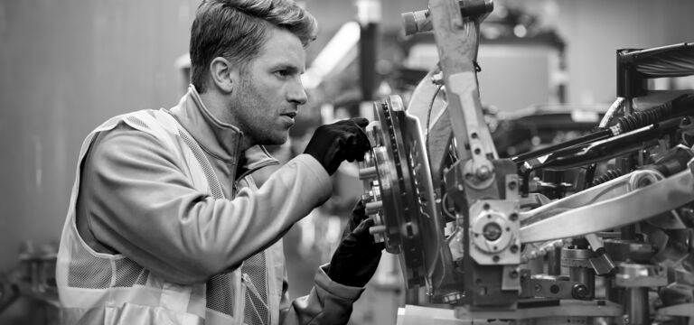 SINGLE-IMAGE_mechanic-calibrating-machine_sept24