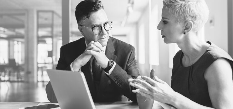 SINGLE-IMAGE_business-employees-discuss-financial-report-with-laptop_feb25