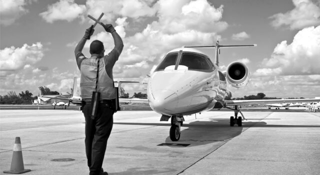 SINGLE-IMAGE_air-traffic-marshall-with-jet_nov23