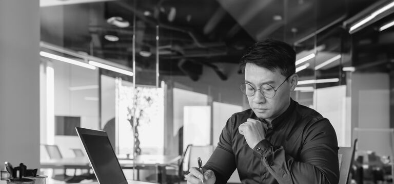 /bynder-asset/bynder:D105F899-6FC1-4DBC-9821E3F44ECBA065/Landscape_MD/SINGLE-IMAGE_man-paperwork-black-and-white_feb24.jpg?1749636888000