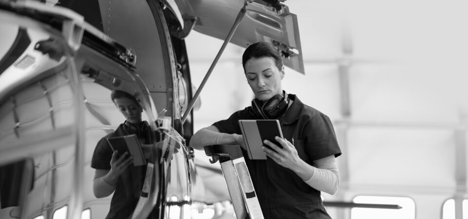 SINGLE-IMAGE_female-engineer-with-tablet-checking-airplane_oct23