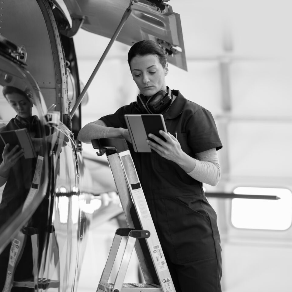 SINGLE-IMAGE_female-engineer-with-tablet-checking-airplane_oct23
