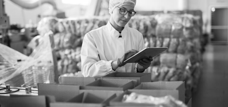 SINGLE-IMAGE_food-industry-woman-checking-stock-tablet_sept23