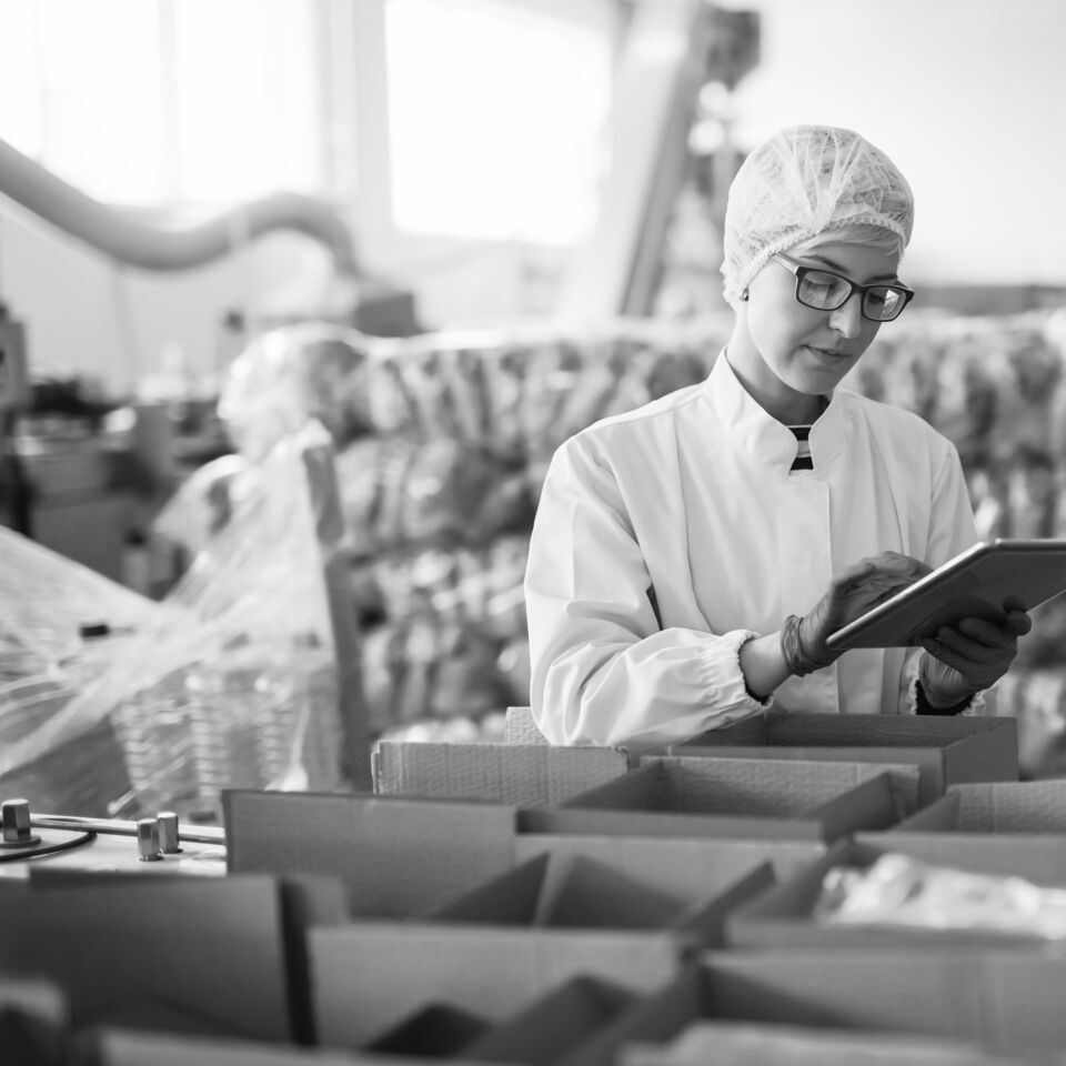 SINGLE-IMAGE_food-industry-woman-checking-stock-tablet_sept23