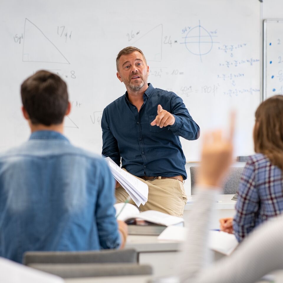 COLOUR-IMAGE-male teacher in high school class-feb26